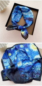Detailed close-up of Van Gogh Starry Night silk scarf texture and gift box presentation