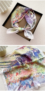 Close-up of oil painting style silk square scarf in gift box with detail texture