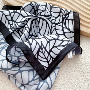 Elegant black and white printed square neck scarf in lightweight polyester silk texture