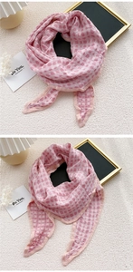 Detailed texture of pink checkered cotton linen scarf with soft breathable fabric