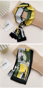 Detail of narrow silk scarf featuring geometric horse prints and elegant color blocks