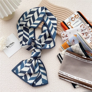 Elegant blue geometric silk ribbon scarf with various pattern options for fashion styling