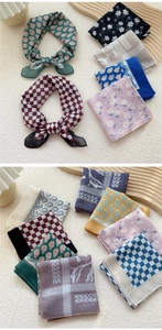Detail showing assorted cotton linen square scarves with classic patterns on wooden tray