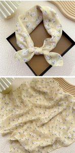 Macro detail of lightweight yellow floral cotton linen scarf with small flower patterns
