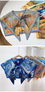 Detail of artistic oil painting printed shoulder shawl with a bow tie closure design