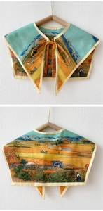 Detail of silk-like shoulder wrap shawl featuring Van Gogh art and elegant front bow tie