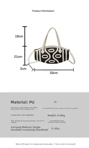 Detailed view of the black and white PU leather barrel bag with dimensions and strap info