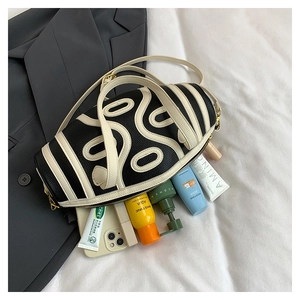 Spacious interior of a contrast cylinder bag showing daily essentials and wave texture