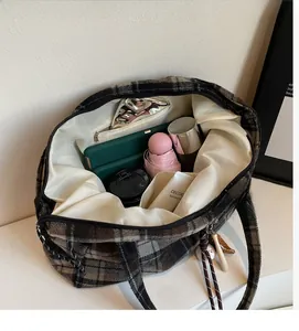 Interior view of large capacity plaid tote bag showing ample space for daily essentials