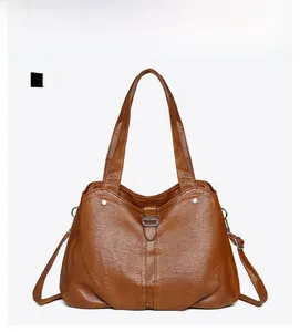 Front view of caramel faux leather tote bag with lychee texture and metallic clasp