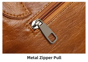 Close-up of premium lychee texture leather and durable silver metal zipper detail