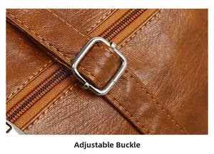 Detail of adjustable buckle and silver hardware on brown litchi pattern leather tote bag
