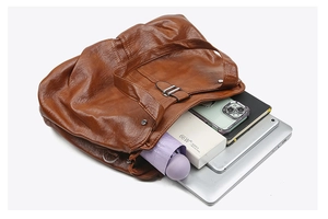 Top-down view of large brown tote bag showing spacious interior with laptop and essentials