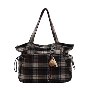 Classic plaid wool tote bag with baseball pendant and black drawstring details