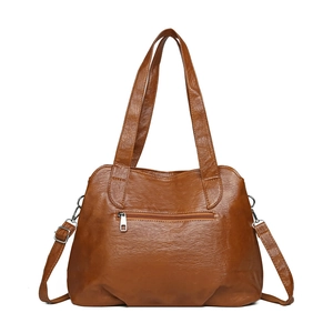 Brown faux leather tote bag for women with wave-shaped opening and adjustable strap