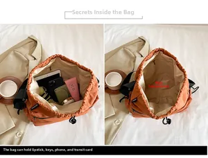 Macro view of nylon bucket bag interior storage showing tablet and daily essentials