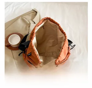 Macro shot showing the spacious interior of nylon bucket bag with zipper pocket and lining