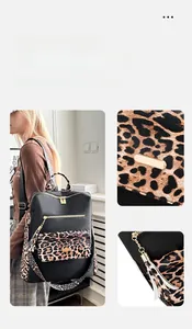 Detail of leopard print flap front pocket and golden hardware on black backpack