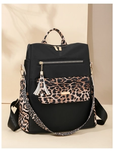 Detail showing high-quality waterproof black nylon and stylish leopard print handles
