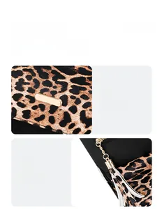Detail view of leopard print backpack showing gold metal bar and tassel zipper pull