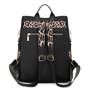 Retro leopard print backpack in black nylon with gold hardware and anti-theft pocket