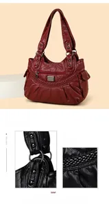 Detail of soft leather handbag showing shiny metal hardware and woven textures