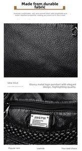 Close-up of black litchi texture soft leather, metal logo, and waterproof bag details