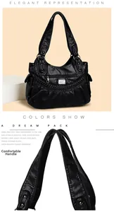Detail view of reinforced handles and textured soft leather on black shoulder bag