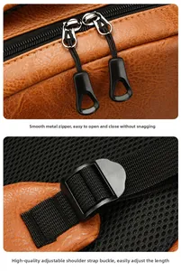 Detailed view of metal zippers and adjustable nylon straps on a brown leather backpack