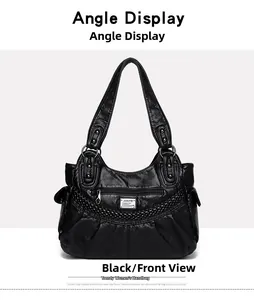 Front detail of black soft leather handbag featuring textured zipper and woven stripes