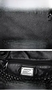 Detailed macro view of black lychee grain leather texture and silver zipper hardware