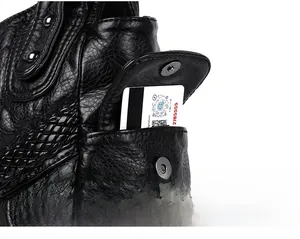 Close-up of black wrinkled leather handbag showing magnetic side pocket and woven trim