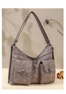 Close-up of vintage taupe tote with multiple cargo pockets and textured soft leather finish