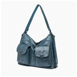 Detail view of large capacity vintage navy blue tote bag with front flap pockets