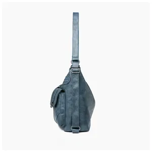 Detailed side view of blue vintage tote with lychee grain texture and multiple pockets