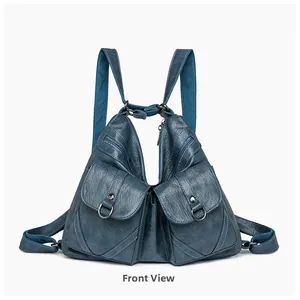 Front view of large vintage blue soft leather backpack with functional front flap pockets