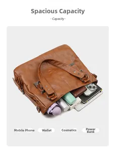 Interior view showing large capacity for phone, umbrella and tablet in brown leather tote bag