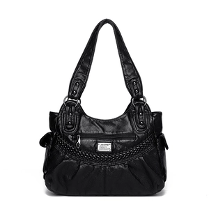 Classic black soft leather shoulder bag with woven details and metal emblem on white background