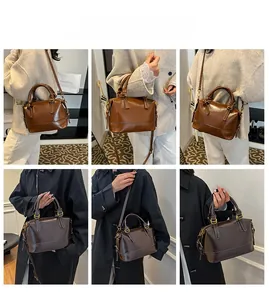 Vues détaillées du sac Boston rétro en finitions cuir marron caramel et café foncé