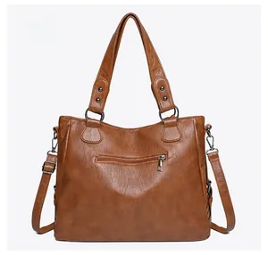 Rear view of brown vintage synthetic leather tote bag with functional zipper pocket