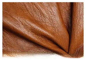 Close-up of premium brown faux leather showing natural lychee texture on tote bag