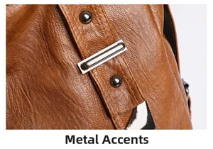 Close-up of textured brown leather bag with silver metallic rivets and hardware details