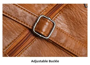 Detail of adjustable buckle and stitching on caramel lychee grain leather tote bag