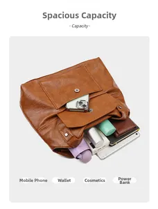 Spacious brown PU leather tote bag interior showing capacity for phone and wallet