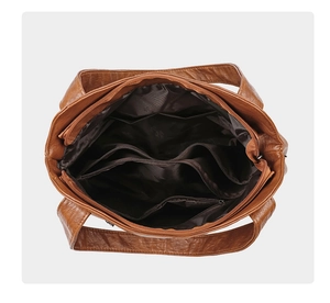 Vertical top view showing multiple compartments and inner zip pocket of large tote bag