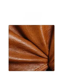 Close-up of soft brown PU leather texture and fine grain detail on the tote bag