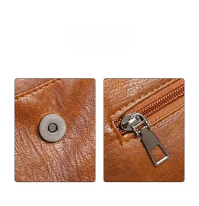 Close-up of brown litchi pattern PU leather tote bag with silver magnetic snap and zipper