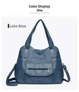 Detail view of lake blue PU leather tote bag with zip pocket and silver hardware