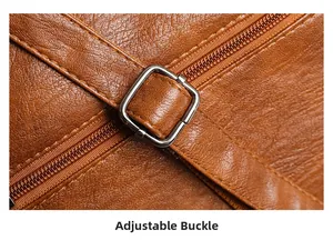 Detail of brown PU leather tote with adjustable shoulder strap and metal buckle