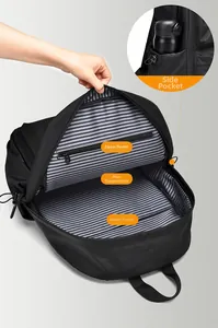 Detailed interior view of a black backpack with striped lining and multiple compartments